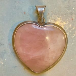 Vintage pink quartz heart pendant in silver bezel.